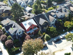 The Real Estate Board of Greater Vancouver says home sales got off to a strong start in the first month of 2024 but the pace of newly listed properties did not keep up with demand. In a photo taken by a drone, Vancouver homes in the Kitsilano neighbourhood of Vancouver are pictured Monday, October 3, 2022.THE CANADIAN PRESS/Jonathan Hayward