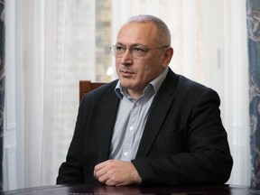 FILE - Exiled Russian businessman and opposition figure Mikhail Khodorkovsky poses during an interview in London, Tuesday, Jan. 16, 2024. An Amsterdam court on Tuesday rejected Russia's final argument in a years-long legal battle over a $50 billion arbitration award that is centered on claims by former shareholders that the Kremlin deliberately bankrupted Russian oil giant Yukos to silence its CEO, a fierce critic of President Vladimir Putin. CEO Mikhail Khodorkovsky was arrested at gunpoint in 2003 and spent more than a decade in prison as Yukos' main assets were sold to a state-owned company. Yukos ultimately went bankrupt.