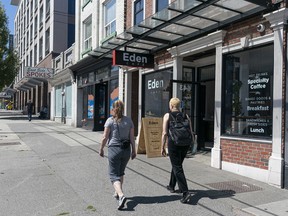Pedestrians walk past stores on East Hastings between Hawkes Street and Princess Street in Vancouver.