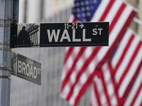 A street sign is seen in front of the New York Stock Exchange in New York.