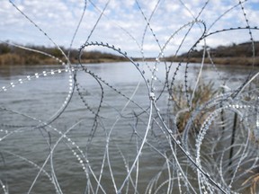 Razor wire is set up along the Rio Grande at Shelby Park on Feb. 3 in Eagle Pass, Texas.