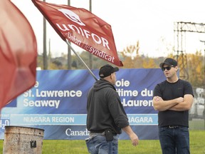 St. Lawrence Seaway workers picket in front of Niagara's Seaway Management Corporation offices in St. Catharines, Ont.