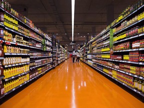 People shop at a Loblaws Cos. Ltd. store in Toronto.