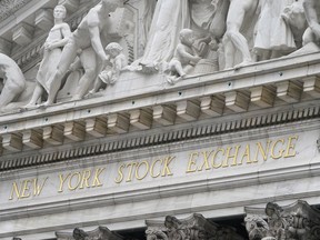 FILE - This Nov. 23, 2020 file photo shows the sign of the New York Stock Exchange in New York, Monday, Nov. 23, 2020.