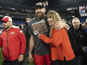 Canadian brands advertising during the Super Bowl are hoping to score with fans of Taylor Swift, who has boosted NFL audiences since she started cheering on her Kansas City-playing boyfriend Travis Kelce at his games. Kelce walks with Swift following the AFC Championship NFL football game between the Baltimore Ravens and the Kansas City Chiefs, Sunday, Jan. 28, 2024, in Baltimore.