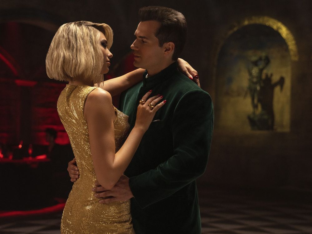 This image released by Apple shows Dua Lipa, left, and Henry Cavill in a scene from 