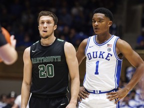 FILE -Dartmouth's Romeo Myrthil (20) stands next to Duke's Caleb Foster (1) during the second half of an NCAA college basketball game in Durham, N.C., Monday, Nov. 6, 2023. Romeo Myrthil and Cade Haskins, two Dartmouth players working to unionize their basketball team say other athletes -- both on campus and from other Ivy League schools -- have been reaching out to see if they can join the effort, Saturday, Feb. 10, 2024.
