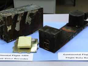 FILE - The cockpit voice recorder, left, and the flight data recorder from Continental flight 1404 airplane accident on display at the National Transportation Safety Board headquarters in Washington, Dec. 22, 2008. Federal accident investigators are pushing for better cockpit voice recorders. They are pointing to limits of the device on the jetliner that suffered a door-panel blowout last month over Oregon. The National Transportation Safety Board said Tuesday, Feb. 13, 2024 that the Federal Aviation Administration should require all current planes to have recorders that can capture 25 hours of audio, up from the current standard of two hours. (AP Photo, file)