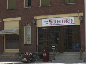 FILE - The offices of the Marion County Record weekly newspaper sit across the street from the Marion County, Kan., Courthouse, Aug. 21, 2023, in Marion, Kan. A reporter for the weekly Kansas newspaper raided last year by police filed a federal lawsuit against the city and current and former local officials over what she says are medical and mental health problems stemming from it. Marion County Record Reporter Phyllis Zorn is seeking $950,000 in damages in her federal lawsuit.