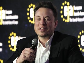 FILE - Tesla and SpaceX's CEO Elon Musk speaks during an interview with Ben Shapiro at the European Jewish Association's conference, in Krakow, Poland, Monday, Jan. 22, 2024. A judge has ordered Musk Saturday, Feb. 10, 2024, to testify as part of the Securities and Exchange Commission's investigation into his $44 billion purchase of Twitter, now called X, in 2022.