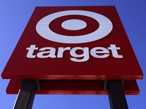 FILE - The bullseye logo on a sign outside the Target store in Quincy, Mass., Monday, Feb. 28, 2022. Target says it will stop selling a product dedicated to Civil Rights icons after a now-viral TikTok spotlighted some significant errors.