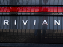 A Rivian electric vehicle sits in a lot at a Rivian facility in Chicago. Rivian's stock plummeted more than 25 per cent on Feb. 22, 2024, after the company announced that it would cut its workforce by 10 per cent.