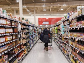 Statistics Canada is set to release its January consumer price index report this morning. A shopper browses in an aisle at a grocery store In Toronto on Friday, Feb. 2, 2024.