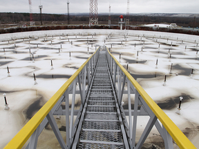 A walkway to the roof of an oil storage tank