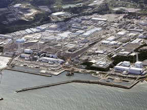 FILE - This aerial view shows the Fukushima Daiichi nuclear power plant in Fukushima, northern Japan, on Aug. 24, 2023, after its operator Tokyo Electric Power Company Holdings began releasing its first batch of treated radioactive water into the Pacific Ocean. A panel of safety experts commissioned by the operator of the tsunami-wrecked Fukushima Daiichi nuclear power plant in Japan urged the company Tuesday, Feb. 13, 2024, to communicate more quickly with the public over incidents such as last week's leak of contaminated water.(Kyodo News via AP, File)