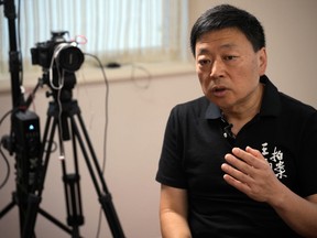 FILE- Wang Zhi'an speaks during an interview with the Associated Press in Tokyo on Oct. 5, 2022. Wang, as well as artist-turned-dissident Li Ying, said in separate posts Sunday, Feb. 25, 2024, that police were interrogating people who followed them on social media, and urged followers to take precautions such as unfollowing their accounts, changing their usernames, avoiding Chinese-made phones and preparing for to be questioned.