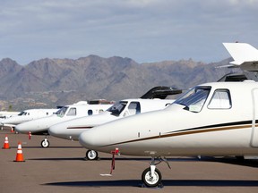 FILE - Private jets sit parked at Scottsdale Airport Jan. 27, 2015, in Scottsdale, Ariz. IRS leadership said Wednesday, Feb. 21, 2024, that the agency will start up dozens of audits on businesses' private jets and how they are used personally by executives and written off as a tax deduction -- as part of the agency's ongoing mission of going after high-wealth tax cheats who game the tax system at the expense of American taxpayers.