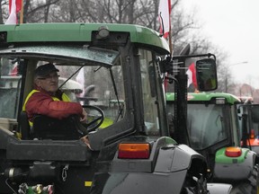 Polish farmers, angry at EU agrarian policy and cheap Ukraine produce imports which, they say, are undercutting their livelihoods, drive their heavy-duty tractors in protest outside the office of the regional governor, in Poznan, western Poland, Friday Feb. 9, 2024.