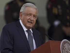 FILE - Mexican President Andres Manuel Lopez Obrador speaks during a military parade in Mexico City, Aug. 13, 2021. Mexico's president acknowledged Tuesday, Feb. 20, 2024 that the armed forces will take over fixing the nation's highways.