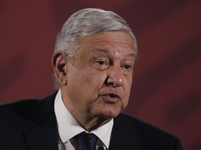 FILE - Mexican President Andres Manuel Lopez Obrador arrives for his daily news conference at the presidential palace in Mexico City, March 24, 2020. Lopez Obrador lashed out at social media platform YouTube on Monday, Feb. 26, 2024, for taking down part of his daily news briefing where he revealed a reporter's phone number.