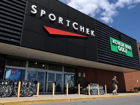 A customer leaves a SportChek and Nevada Bob's Golf store in Ottawa on Monday, May 9, 2011. Despite an unseasonably warm winter, there's a chill across the Canadian retail landscape.