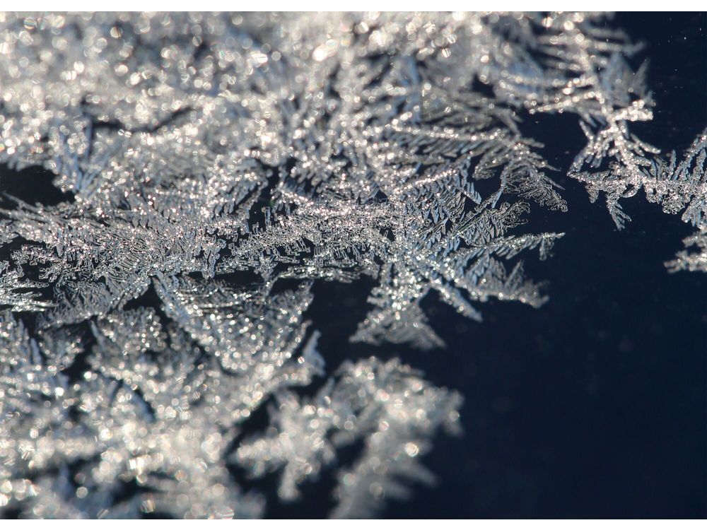 Frost crystals on a glass window in Canada.