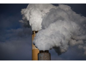 Steam billows out of the stacks at the FirstEnergy Corp. Bruce Mansfield coal-fired power plant in Shippingport, Pennsylvania, U.S., on Wednesday, Dec. 6, 2017. Across America, few places are as dominated by big, centralized power plants as Shippingport. It was here, in the 1950s, that the federal government teamed up with private industry to build the country's first nuclear power plant. Photographer: Justin Merriman/Bloomberg