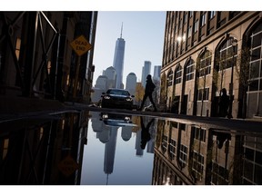 A pedestrian walks along Hudson Street in Jersey City, New Jersey, U.S., on Tuesday, April 23, 2019. U.S. equities climbed on the back of better-than-forecast earnings, while the dollar strengthened and Treasury yields dipped. Photographer: Michael Nagle/Bloomberg