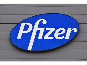 A logo on the Pfizer Inc. facility in Puurs, Belgium, on Thursday, Dec. 3, 2020. The quick approval of Pfizer Inc.'s coronavirus vaccine in the U.K. isn't likely to accelerate the availability of the shot in Asia, as countries work to complete local safety tests and negotiate deals. Photographer: Geert Vanden Wijngaert/Bloomberg