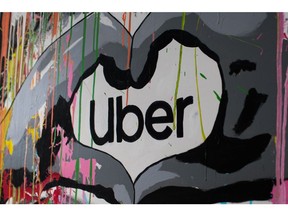A mural featuring the logo of Uber Technologies Inc. at the company's headquarters in Paris, France, on April 13, 2022. Uber leans heavily on its experiences in Paris and London in a report that serves as something of a road map for electrifying its ride-hailing business and partnering with industry and policymakers.