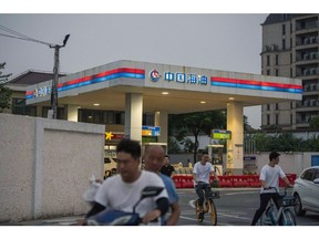 Signage atop a China National Offshore Oil Corp. filling station in Shanghai, China, on Friday, Aug. 11, 2023. Cnooc is scheduled to release earnings results on Aug. 17.