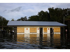 A retail store partially submerged in floodwaters after Hurricane Idalia made landfall in Cristal River, Florida, US, on Wednesday, Aug. 30, 2023. Hurricane Idalia knocked out power to hundreds of thousands of Florida customers, grounding more than 1,800 flights and unleashing floods along far from where it came ashore as a Category 3 storm earlier Wednesday.