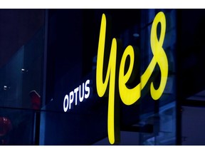 An Optus store window in Sydney. Photographer: Lisa Maree Williams/Getty Images