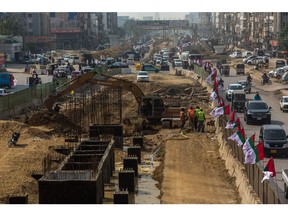 Vehicles pass a construction site of the Karachi Bus Rapid Transit (BRT) Red Line Project in Karachi, Pakistan, on Wednesday, Nov. 29, 2023. Pakistan is scheduled to release consumer price index (CPI) figures on Dec 1.