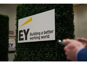 Ernst & Young LLP signage during The AI Summit New York 2023 in New York, US, on Wednesday, Dec. 6, 2023. The conference's agenda is designed to enable discovery of actionable insights to leverage AI for commercial success.