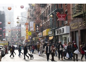 Pedestrians in the Chinatown neighborhood of New York, US on Tuesday, Dec. 26, 2023. US foreign travel spending rose 19% in the third quarter to $41.3 billion compared with the same period the previous year and 120% from 2021, according to balance of payments data from Bureau of Economic Analysis. Photographer: Eilon Paz/Bloomberg