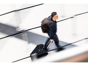 A passenger wheels luggage through the departures terminal at Budapest Ferenc Liszt International Airport in Budapest, Hungary, on Monday, Jan. 8, 2024. Hungary is looking to attract the Qatar Investment Authority to a consortium the government is forming for the purchase of Budapest Airport.