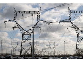 High-voltage electricity transmission towers at the Gravelines nuclear power station in Dunkirk, France. Photographer: Benjamin Girette/Bloomberg