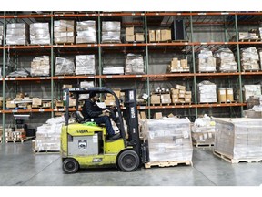 A worker operates a forklift at a Woodland Group fulfillment center in Elizabeth, New Jersey, US, on Wednesday, Jan. 17, 2024. The US Census Bureau is scheduled to release wholesalers inventories figures on February 8. Photographer: Eilon Paz/Bloomberg