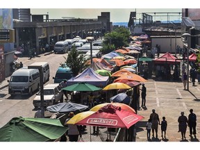 Umbrellas cover informal market stalls in Johannesburg, South Africa. Photographer: Leon Sadiki/Bloomberg