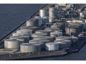 Oil storage tanks in Osaka Bay in Osaka, Japan, on Monday, Feb. 12, 2024. Japan is scheduled to release its fourth-quarter gross domestic product (GDP) figures on Feb. 15. Photographer: Buddhika Weerasinghe/Bloomberg