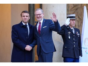 Emmanuel Macron, France's president, left, greets Petr Fiala, Czech Republic's prime minister, at the Elysee Palace in Paris, France, on Monday, Feb. 26, 2024.