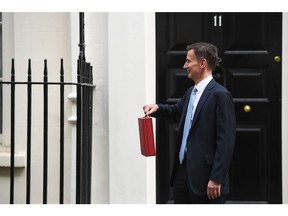 Jeremy Hunt's budget statement left Conservative Party lawmakers worried that pre-election giveaways will not win over enough UK voters to prevent defeat.