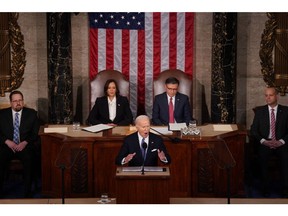 US President Joe Biden, center, speaks during a State of the Union address. Photographer: Al Drago/Bloomberg