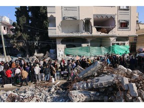 Building rubble beside a street market in the center of Deir al-Balah, central Gaza