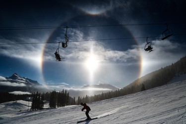 A large sundog lights up the sky behind the Cascade chairlift at Banff’s Mt. Norquay ski resort, which is owned by the Waterouses.