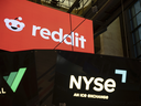 Reddit Inc. signage is seen on the New York Stock Exchange trading floor, prior to Reddit's initial public offering, Thursday, March. 21, 2024. 