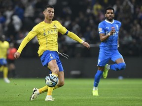 Al Nassr's Cristiano Ronaldo kicks the ball during Riyadh Season Cup 2024 final match against Al Hilal at Kingdom Arena Stadium in Riyadh, Saudi Arabia, Thursday, Feb. 8, 2024.