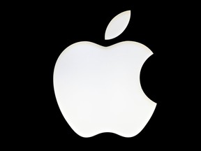 FILE - A logo of the Apple company is pictured in Berlin, Germany, Wednesday Jan. 4, 2017. Apple is opening small cracks in the iPhone's digital fortress as part of a regulatory clampdown in Europe that is striving to give consumers more choices -- at the risk of creating new avenues for hackers to steal personal and financial information stored on the devices.
