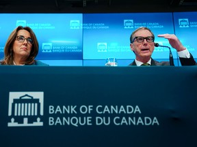 Bank of Canada governor Tiff Macklem and senior deputy-governor Carolyn Rogers, answer questions at a press conference in Ottawa after the decision Wednesday.